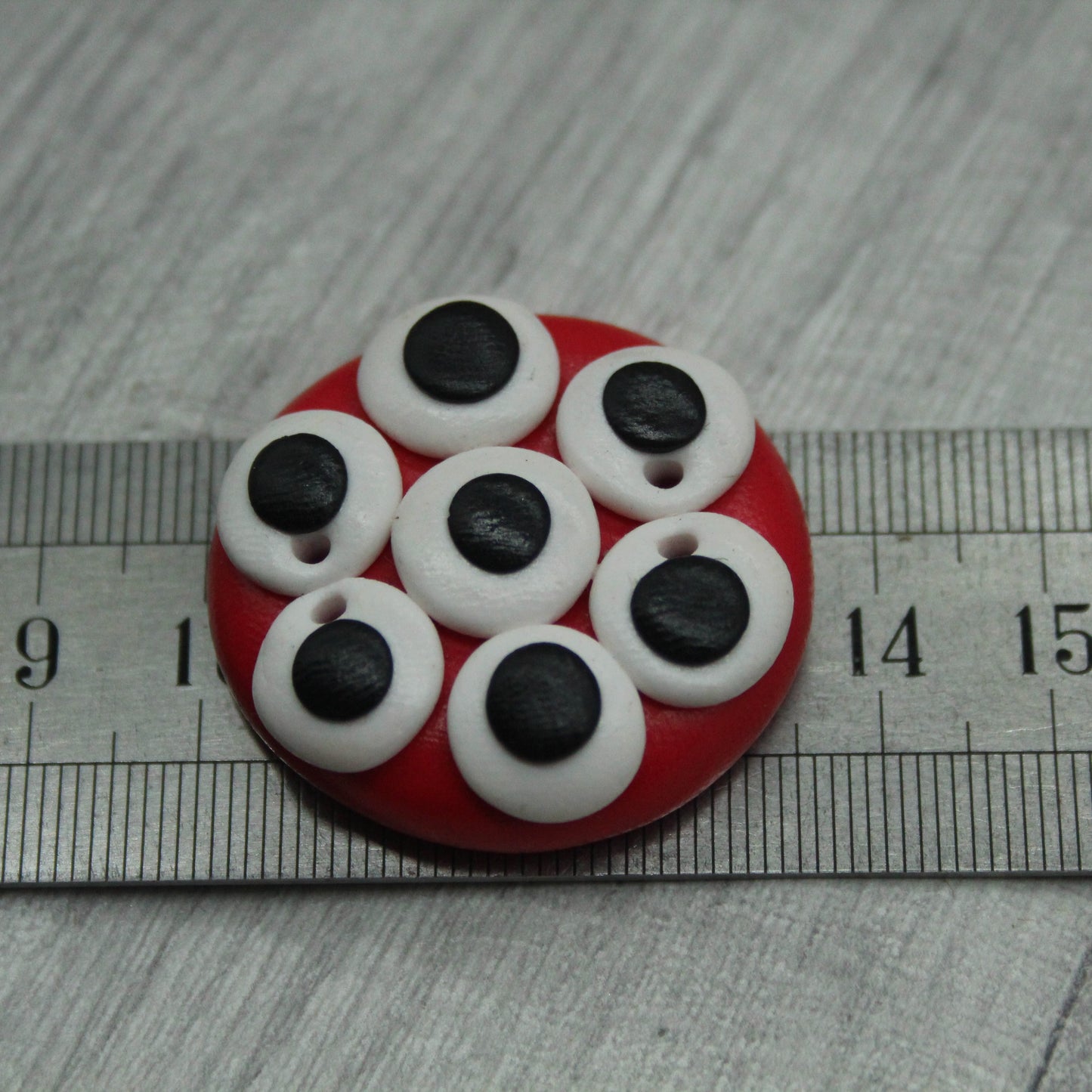 Alien eyes polymer clay button
