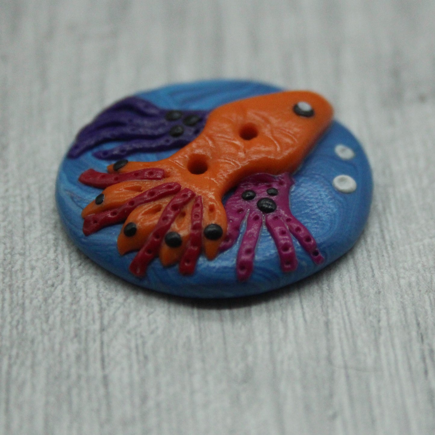 Fish polymer clay button