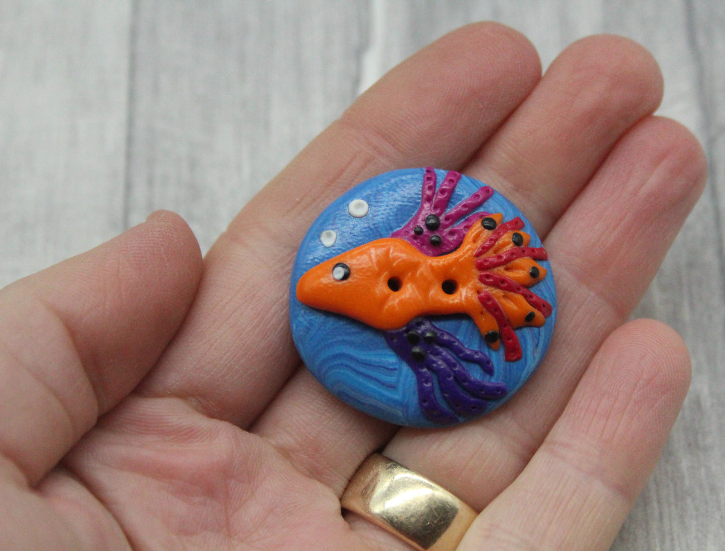 Fish polymer clay button