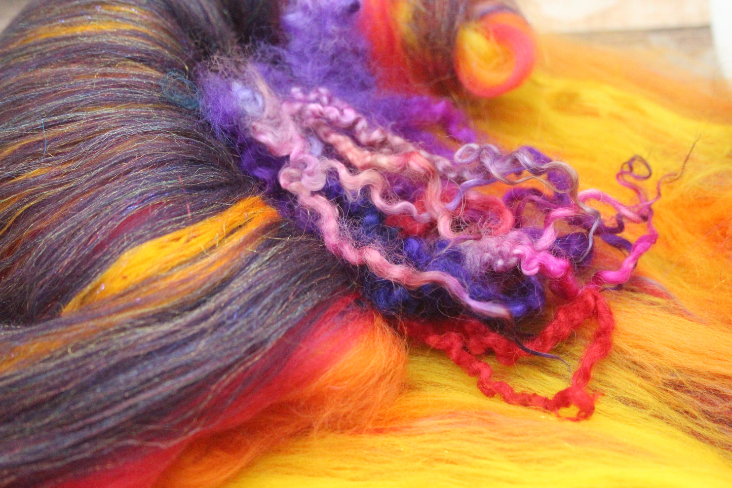 Merino Art Batt  - Purple Red Orange Yellow  -  76 grams 2.6 oz - 5 grams of locks - Wool for felting, spinning and weaving
