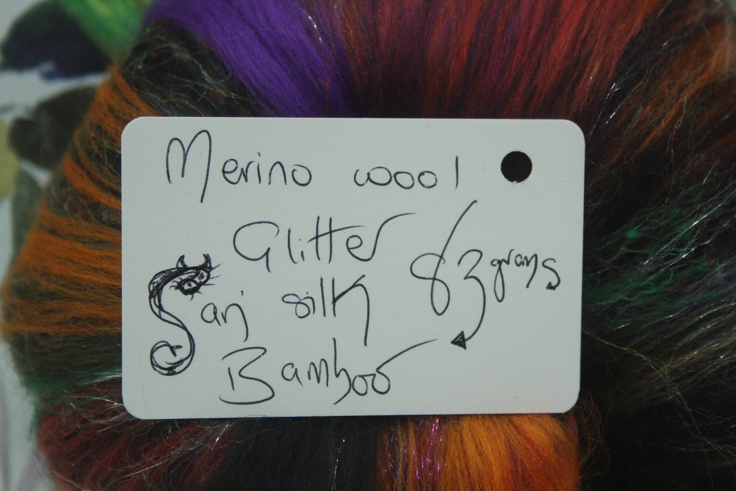 Merino Art Batt  - Black Blue Purple Orange - 83 grams 2.9 oz - Wool for felting, spinning and weaving