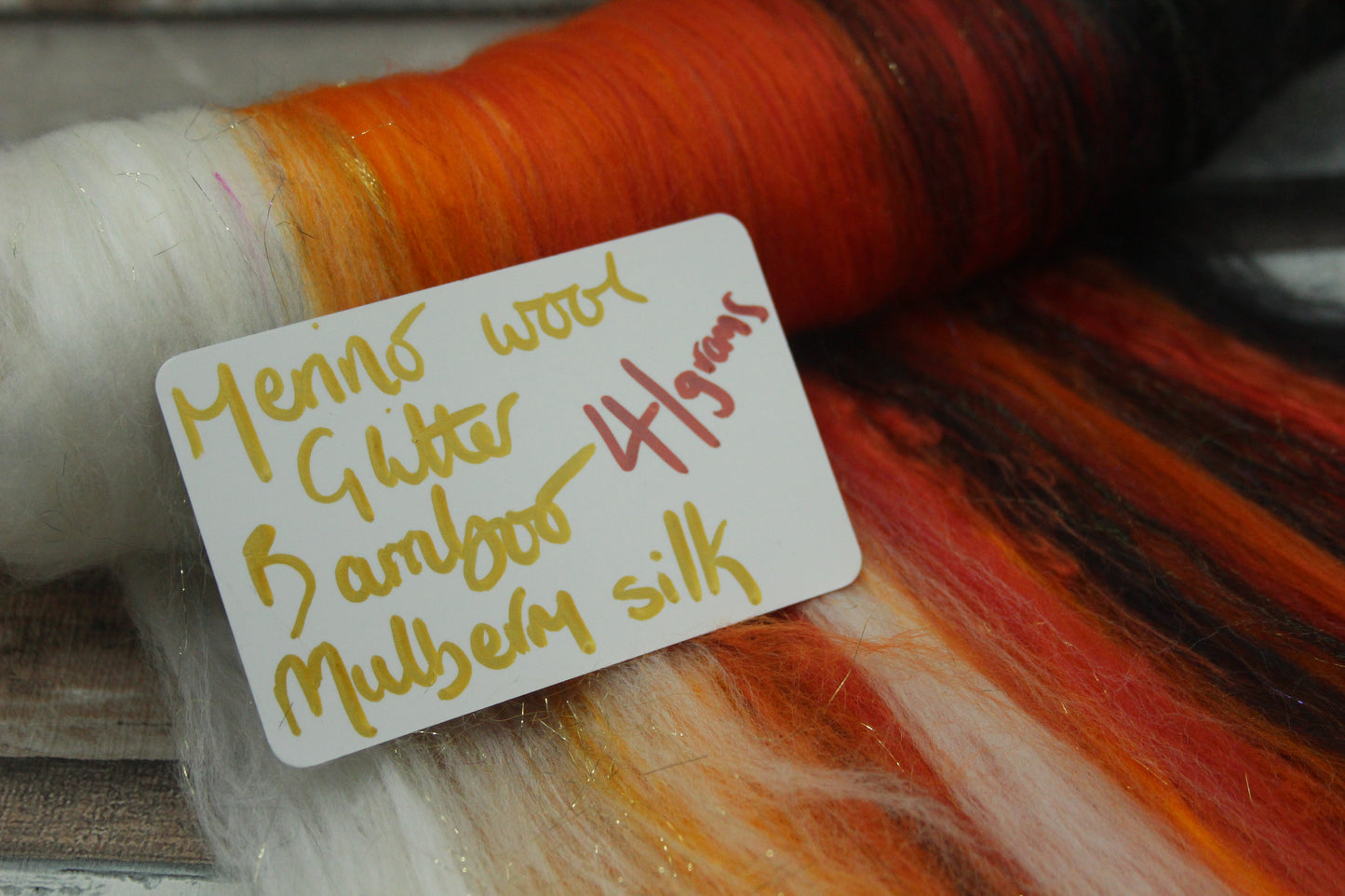 Merino Art Batt  - Black Orange White - 41 grams 1.4 oz - Wool for felting, spinning and weaving