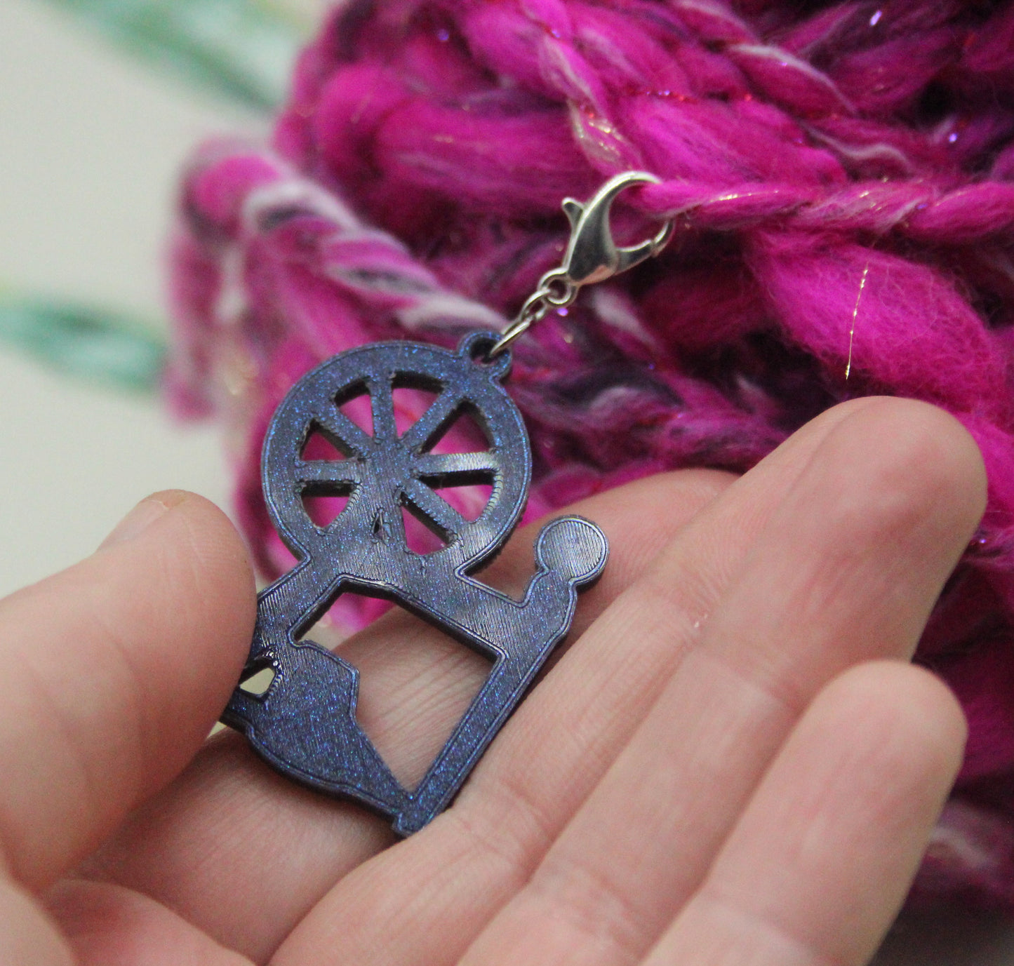 Spinning wheel stitch keeper