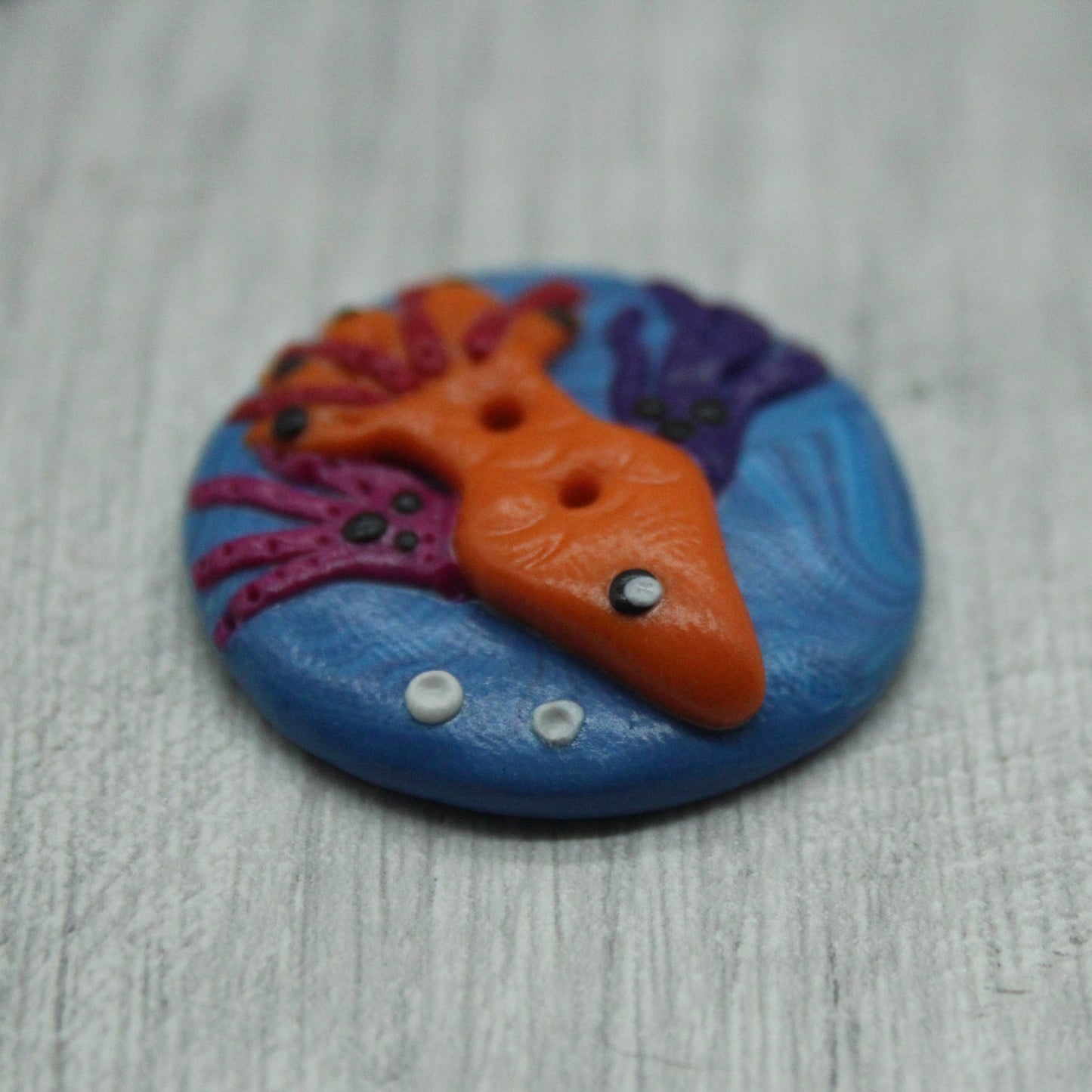 Fish polymer clay button
